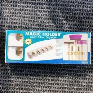 Magic holder broom & mop organizer